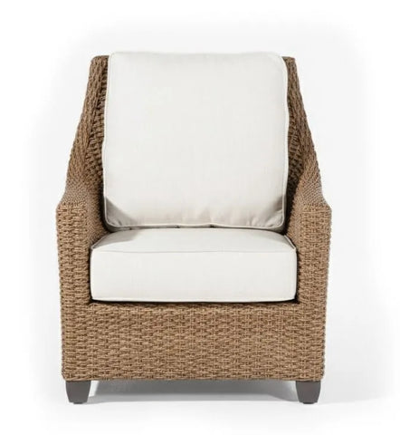 Wicker armchair with white cushions on a white background