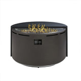 A round outdoor gas fire pit table